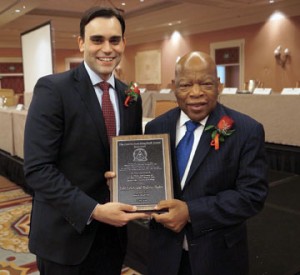 Andrew Aydin ’06 and Congressman John Lewis hold their 2014 Coretta Scott King Book Award.