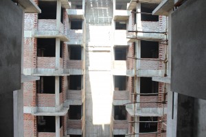 Construction workers working on a luxury residential complex