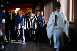 A group of politicians including former Minister of Health, Labour and Welfare, Hidehisa Otsuji, are led by a Shinto priest as they the visit Yasukuni Shrine.  http://www.ibtimes.co.uk/japan-pm-shinzo-abe-sends-offering-yasukuni-shrine-angering-china-south-korea-1470538 