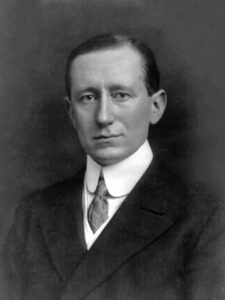 A portrait of a man in suit and tie