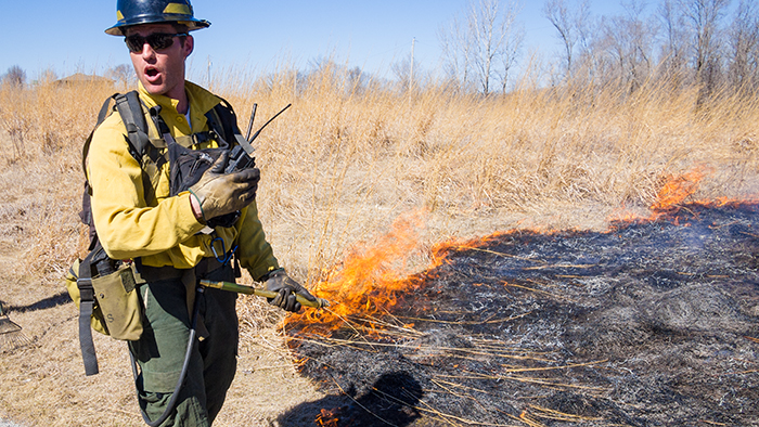Chad Graeve, the instructor points out the finer points of a grass fire.