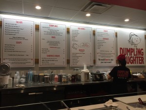 This is the center of the restaurant, a blown-up menu and the front of the open kitchen. 