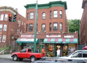 This is an image of storefronts on Park St. It features a nail salon, barber shop, and a locksmith. This photo was retrieved from zillow.com. 