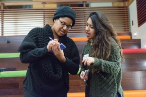 Posse Scholar Ainslya Charlton ’16 and Alicia Abbaspour ’18 engage in an activity at the January leadership summit. 
