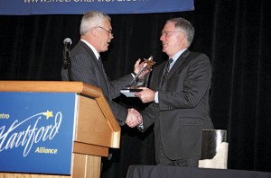 MetroHartford Alliance President and CEO Oz Griebel presents Jones with the Rising Star Award in January 2014 in honor of Jones’s leadership and service to the College, the city, and the region.