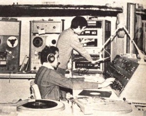 On-air teamwork: Host Howard Goldstein (left) makes an adjustment on the control board while Jack Santos turns on a public service announcement in 1974. Despite being blind, Goldstein was on the WRTC staff for many years.